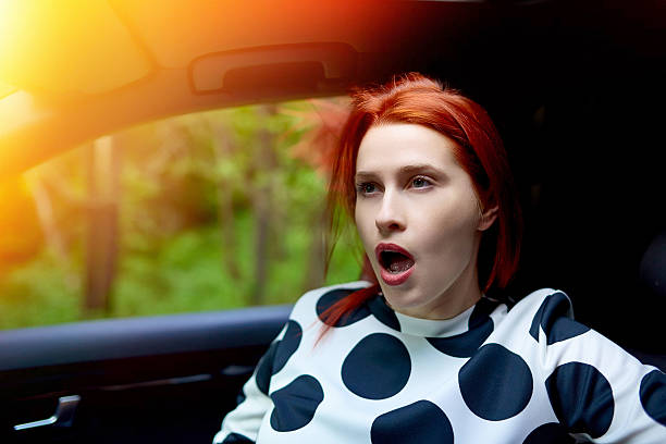 istock yawning in the car 481678292
