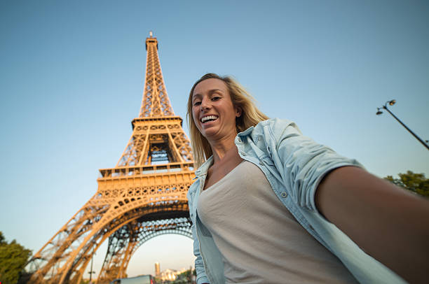 istock Young woman in Paris taking selfie using mobile phone 481678876