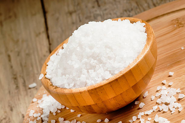 istock Large white sea salt in a wooden bowl 481678978