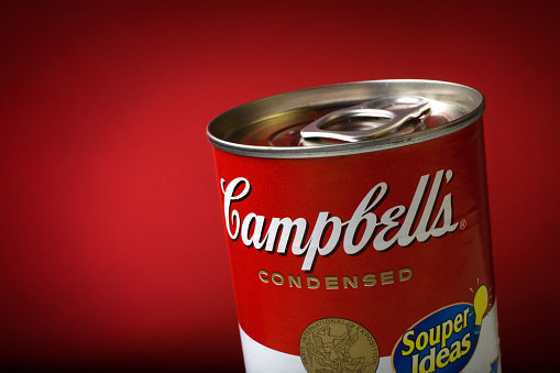 Brasilia, Brazil - August 30, 2008: Classic Campbell's Condensed Soup Can registered on a red background. Produced in 1962 by the american artist Andy Warhol, the art that illustrates the can became famous worldwide as a Pop Art Icon.  