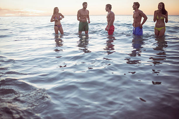istock Happy friends having fun in the water 481682872
