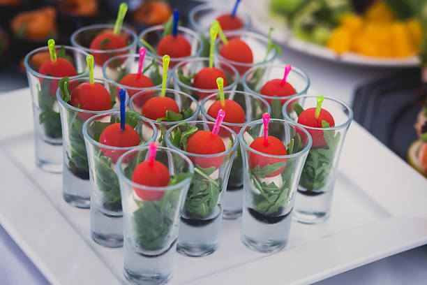 istock Beautifully decorated catering banquet table with different food snacks appetizers 481683082