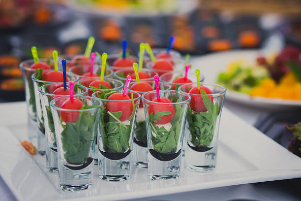istock Beautifully decorated catering banquet table with different food snacks appetizers 481683086