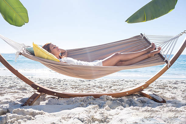 istock Brunette relaxing in the hammock 481683334