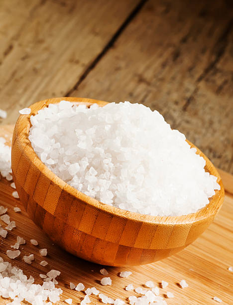 istock Large white sea salt in a wooden bowl 481684748