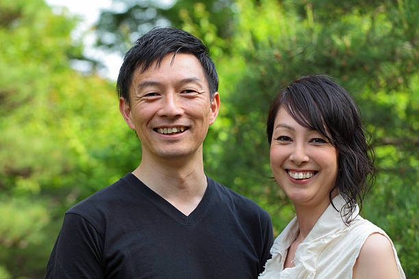 istock happy mature couple smiling and looking at camera 481685632