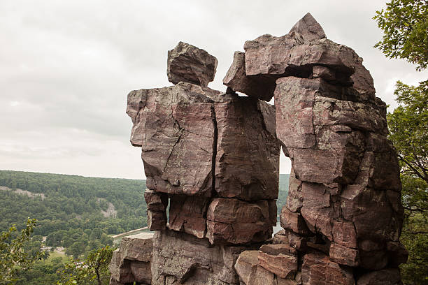 Devil's Doorway rock outcropping in a Wisconsin State Park A classic landmark and short hike in Devil's Lake State Park, part of the the Wisconsin State Park system.  outcrop stock pictures, royalty-free photos & images