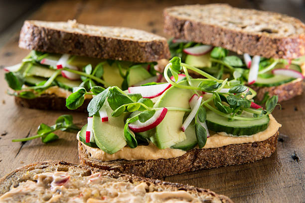 Vegetarian Sandwich's on a Rustic Wood Background. stock photo