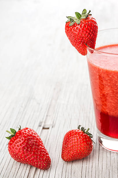 istock Fresh strawberry and juice in glass 481690032