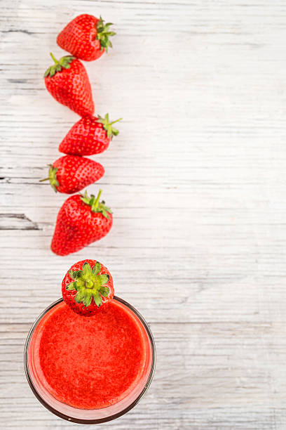 istock Fresh strawberry and juice in glass 481690042