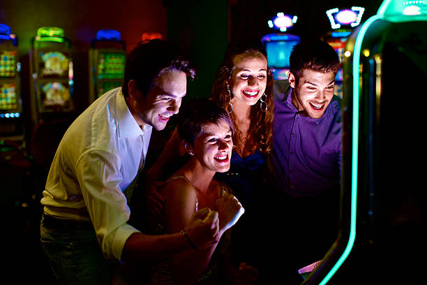 istock Friends gambling on slot machines 481692185