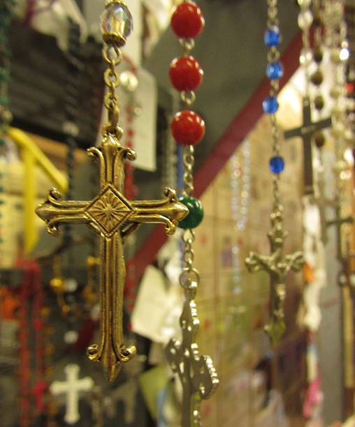 istock Close-Up of Gold Rosary with Multiple Rosary Background 481694916