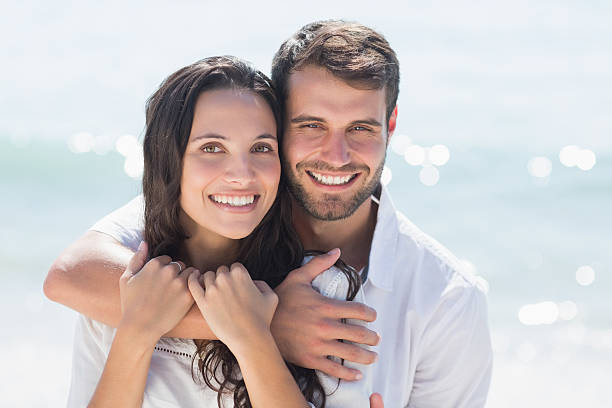 istock happy couple smiling at camera 481698842