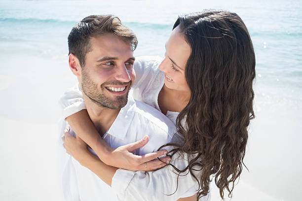 istock happy couple smiling at each others 481698886