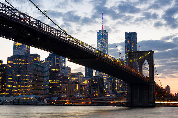 istock Brooklyn Bridge over East River at night in NYC 481699328