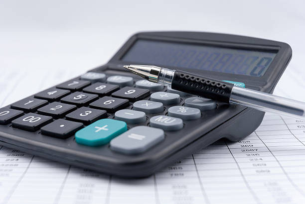 istock calculator and pen on a business background 481699462