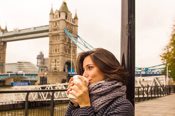 istock Beautiful woman warms up drinking from a coffee cup 481701943