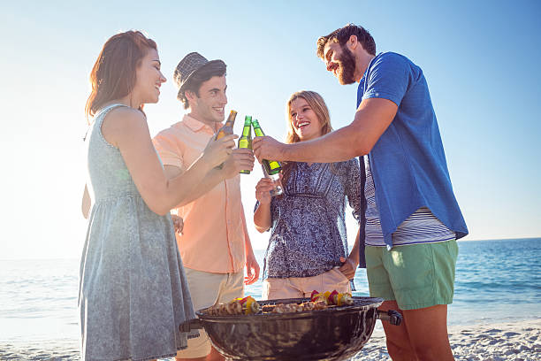 istock Happy friends doing barbecue and drinking beer 481704210