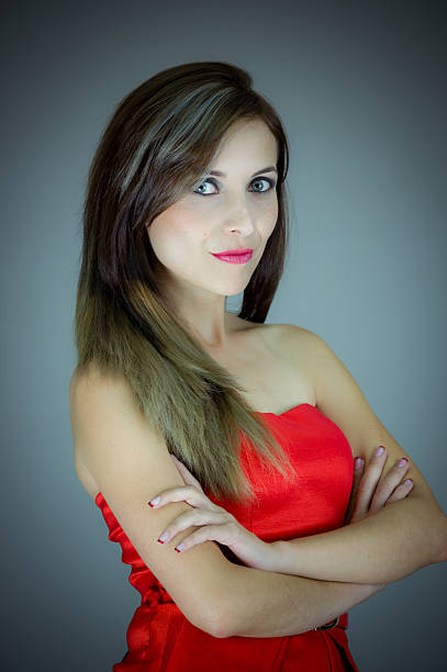 istock Hispanic female model posing for camera in studio with arms 481705480