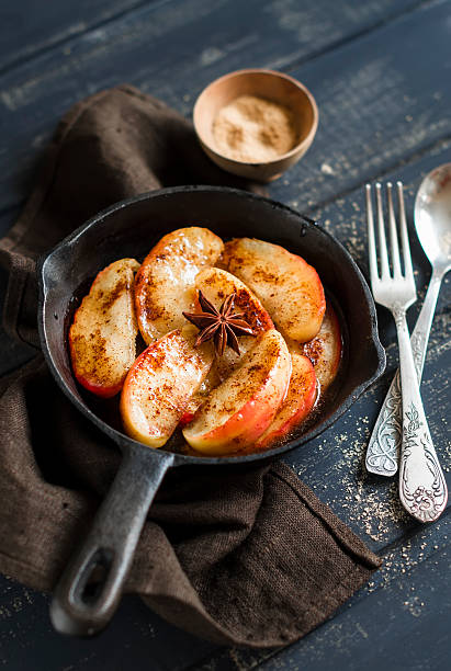 istock caramelized apples with cinnamon in a vintage pan 481705558