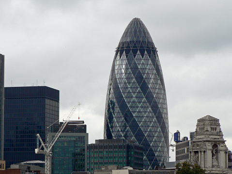 View of the Gherkin, London, over the tops of the buildings in the City of London
