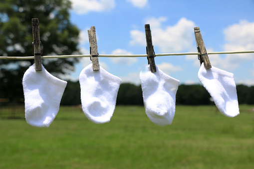 Baby clothes drying on a clothes line