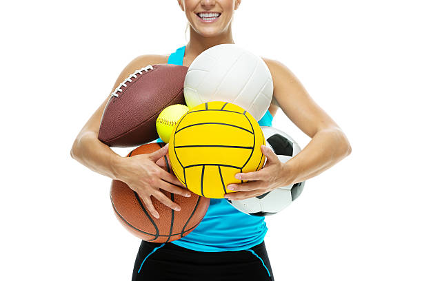 istock Smiling woman holding sport balls 481708940