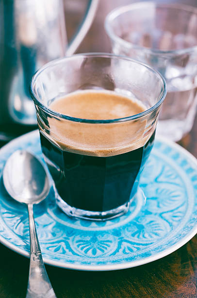 istock Bistro glass with espresso standing on blue saucer 481709686