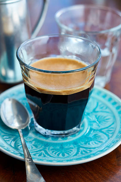 istock Bistro glass with espresso standing on blue saucer 481709690