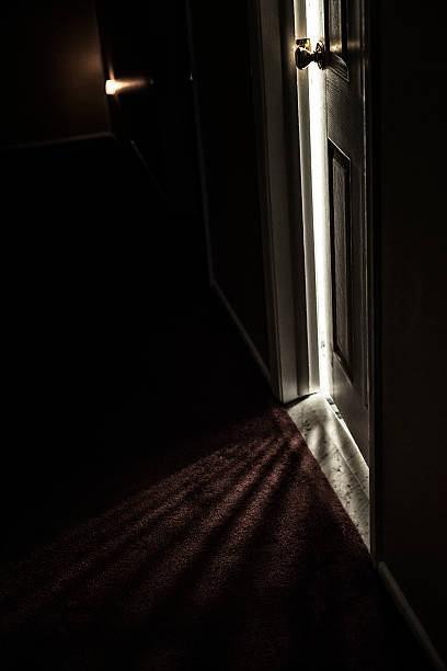 istock Spooky Dark Hallway Door Cracked Open 481710518