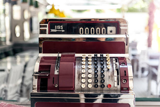 Old cash register on the desk