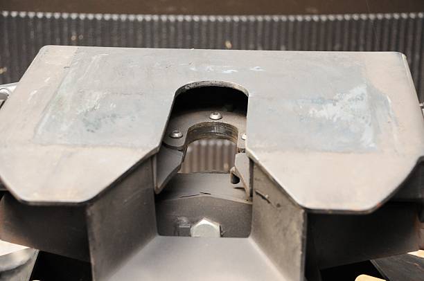 Fifth wheel hitch Close up photograph of fifth wheel recreational vehicle hitch.  Image shows locking jaw of hitch with sliding plate. hitchhiking stock pictures, royalty-free photos & images