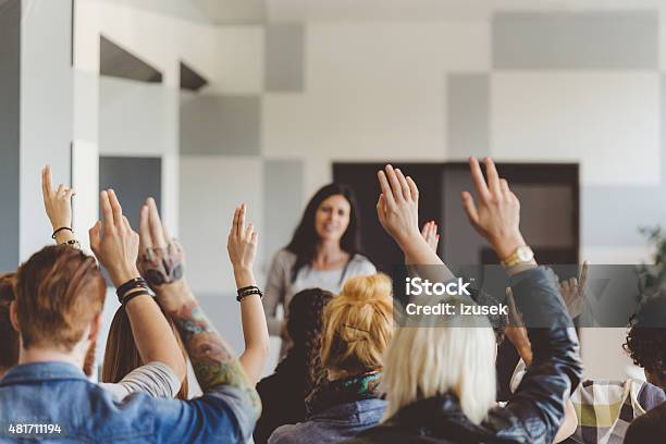 Student Voting On Seminar Raising Hands Stock Photo - Download Image Now - Voting, Classroom, Hand Raised
