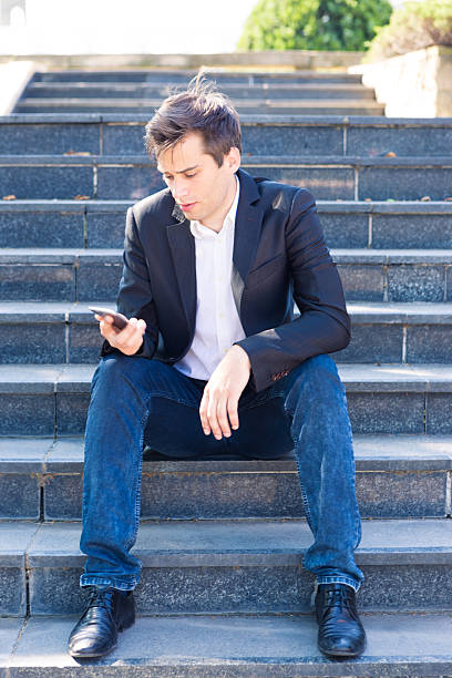 istock Businessman Outside Office On Mobile Phone 481711464