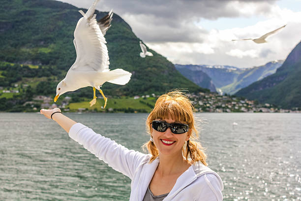 istock Woman enjoy seagull 481714526
