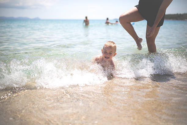 istock Mother with baby boy in ocean 481715158