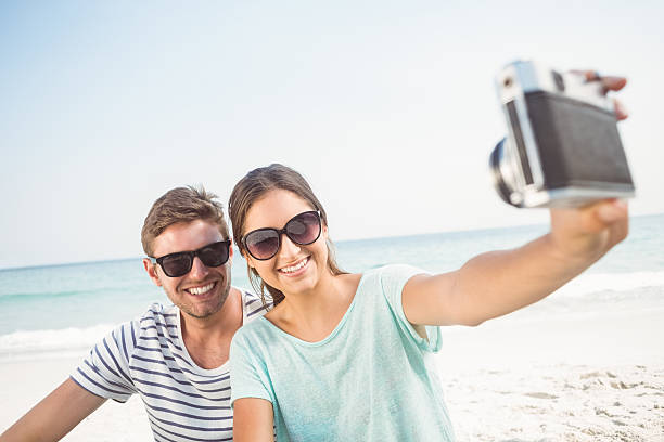 istock happy couple taking a selfie 481716268