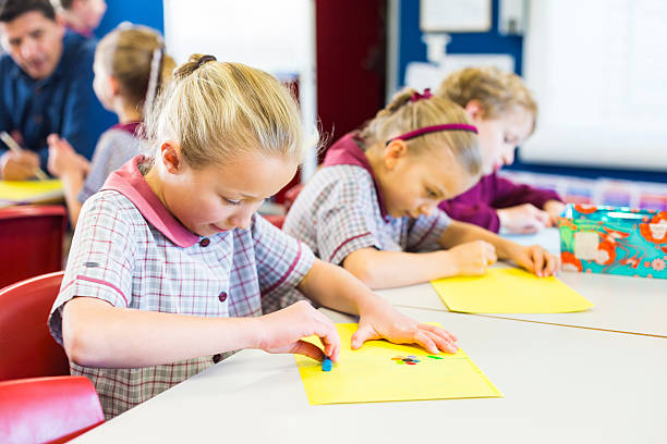 istock School Children Doing Drawings in the Classroom 481716580