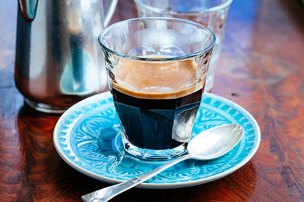 istock Bistro glass with espresso standing on blue saucer 481717192