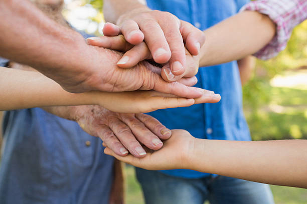 istock Family putting their hands together 481717450