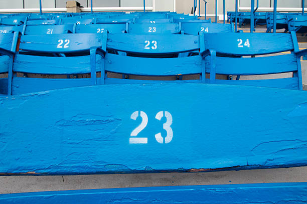Blue Stadium Seats A set of blue seats in an empty sports stadium wooden bleachers stock pictures, royalty-free photos & images