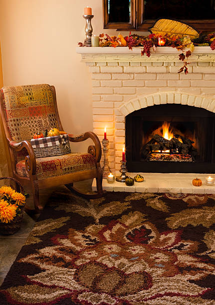 istock Old fashioned Thanksgiving fireplace and rocker in morning light -(P) 481717780