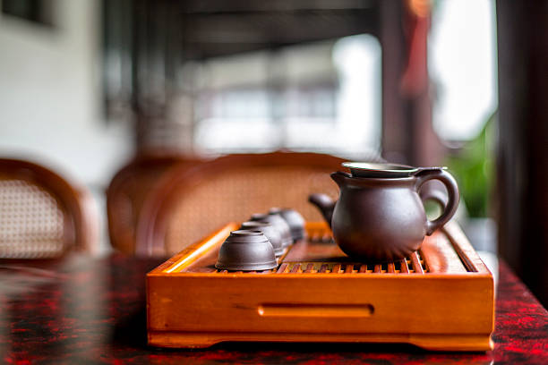 teapot and tea cup on table in tea house
