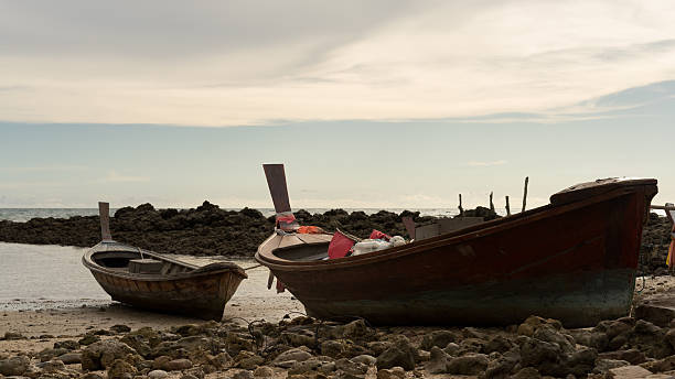 istock Fishing boats on rocky beach 481720456