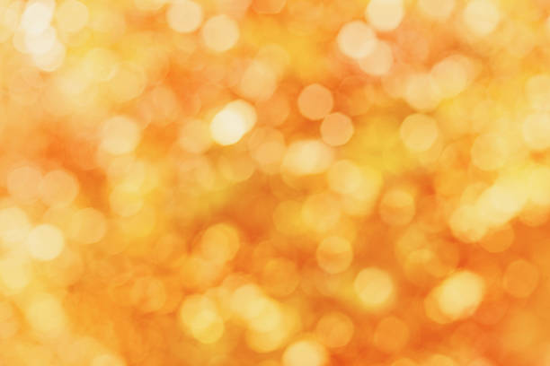 istock defocused autumn leaves golden bokeh for wallpaper or background pattern 481721342