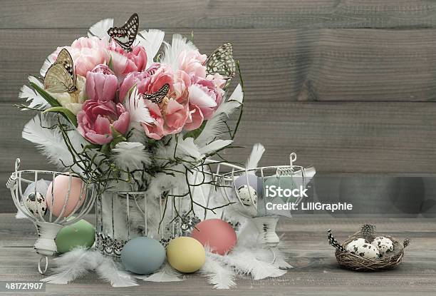 Pink Tulips Feathers Butterflies And Easter Eggs Stock Photo - Download Image Now - Animal Nest, Birdcage, Butterfly - Insect