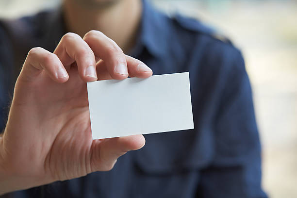 istock businessman giving a business card 481722318