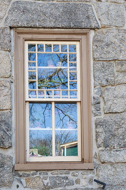 istock Reflections on the Window of an Old Stone House, Verticle 481722930
