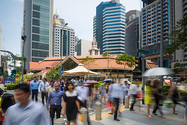 The Telok Ayer Market, Singapore Singapore, Singapore - July 13, 2015: Office workers taking the pedestrian crossing during lunch break at the Telok Ayer Market aka Lau Pa Sat. food court photos stock pictures, royalty-free photos & images