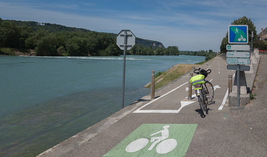 Passage of the future bike route ViaRhona stretching from Lake Geneva to the Mediterranean, on the banks of the Rhone, at the level of village of the Sault Brenaz in the direction of Lyon.